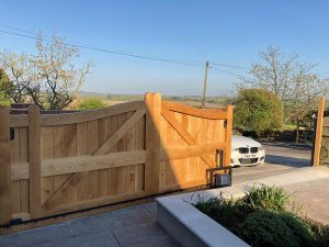 A wooden gate in front of a house - Patron Security Ltd