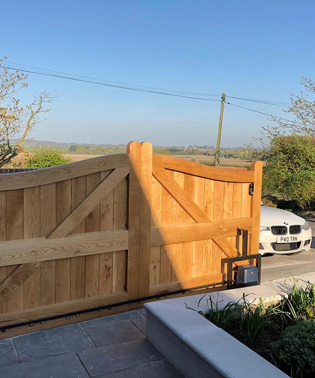 A wooden gate in front of a house - Patron Security Ltd