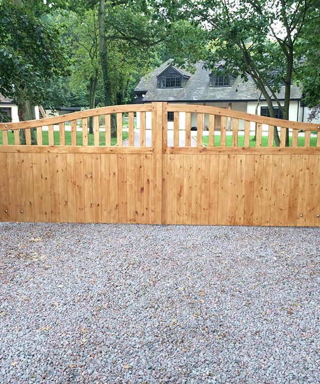 A wooden gate in front of a house - Patron Security Ltd