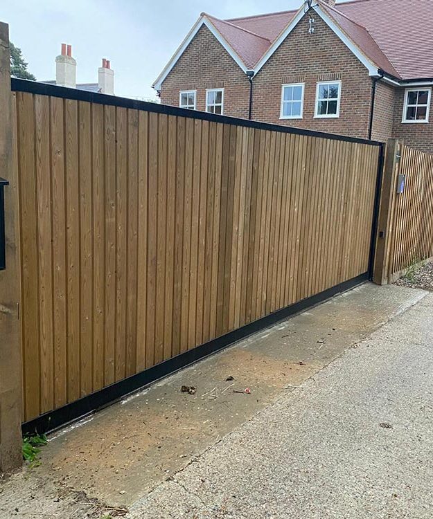 A wooden gate in front of a house - Patron Security Ltd